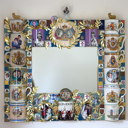 Mirror extravagantly framed with memoriabilia of Kings and Queens