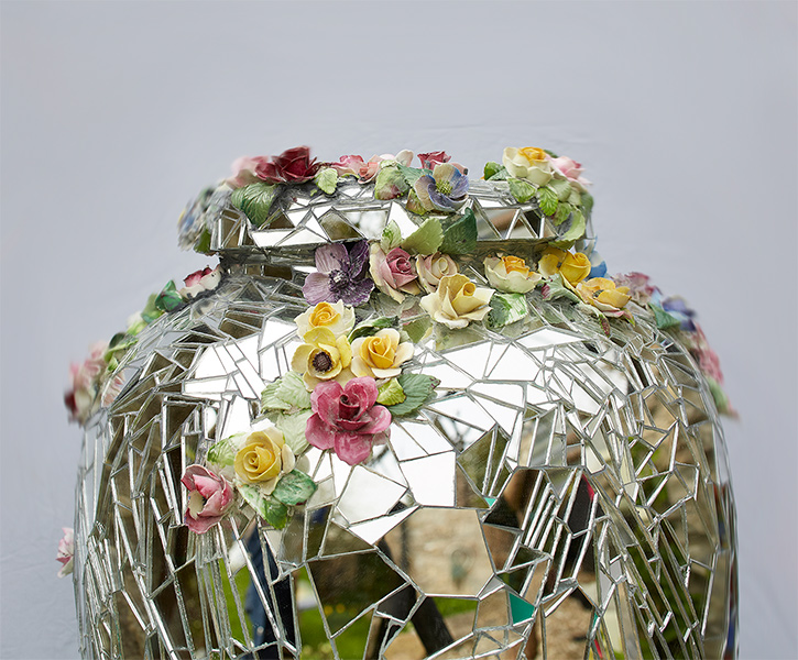 detail of mirror urn with flowers